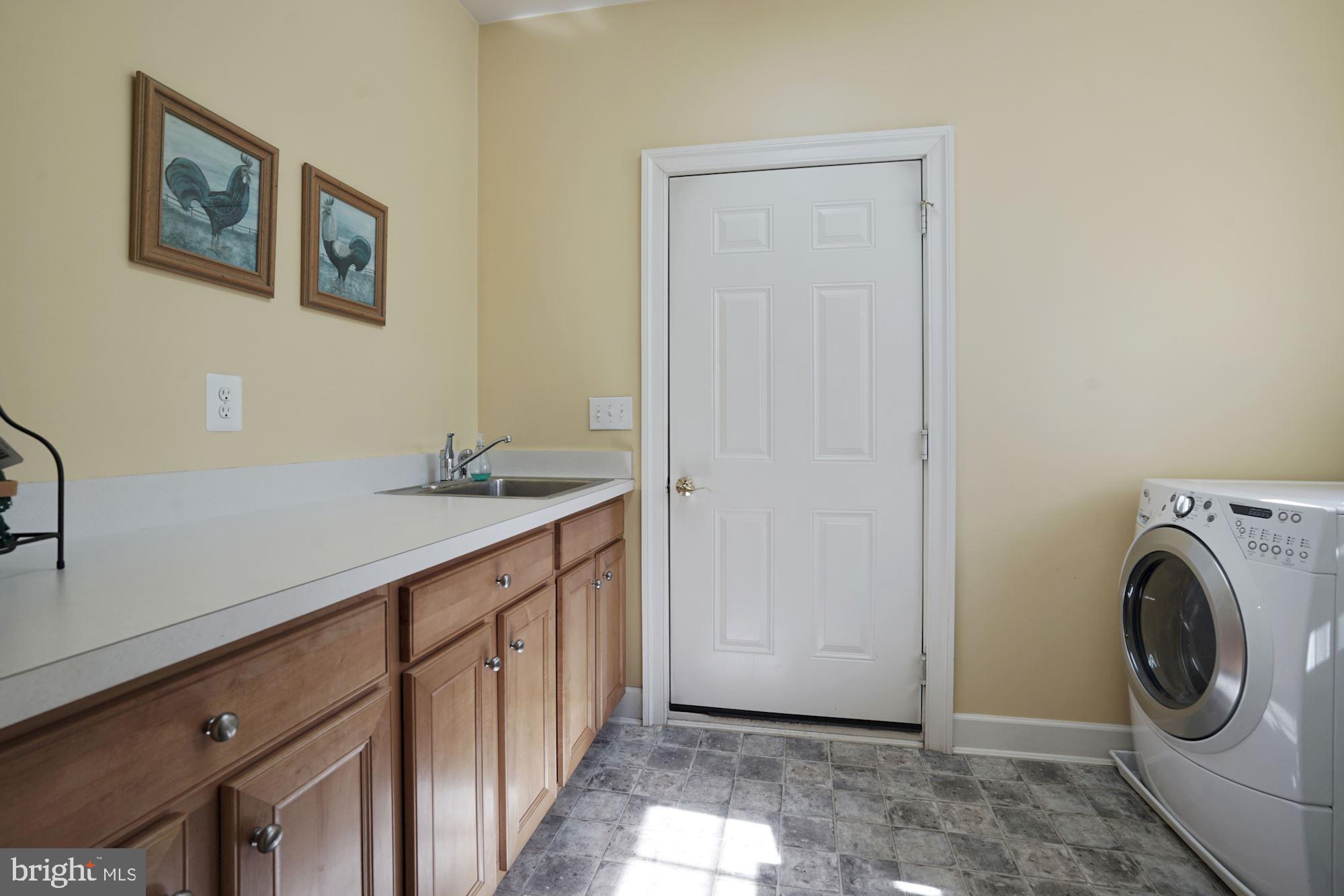 17501 Nesbitt Farm Lane Sandy Spring, MD 20860 - Photo 51 of 61 Laundry room with cabinets, counter and sink