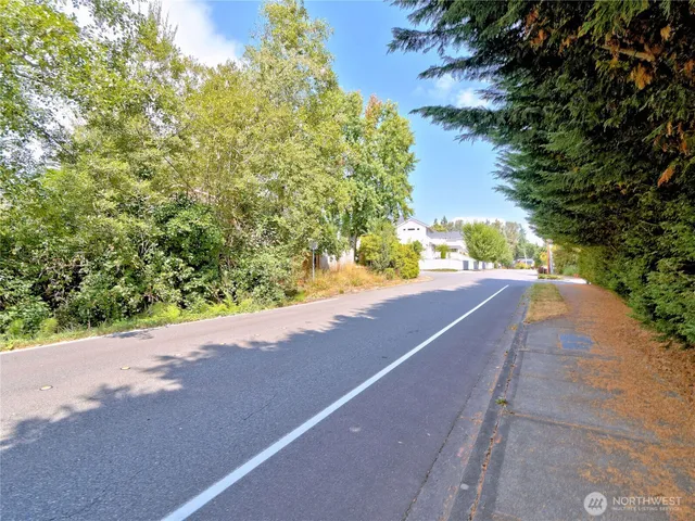 a view of a road with a yard