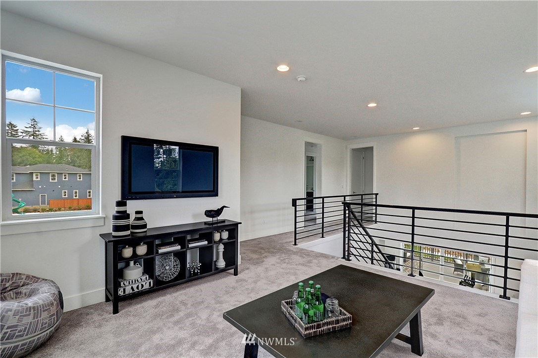3304 219th Place Southeast, Unit 7 Bothell, WA 98021 - Photo 12 of 25 a living room with furniture