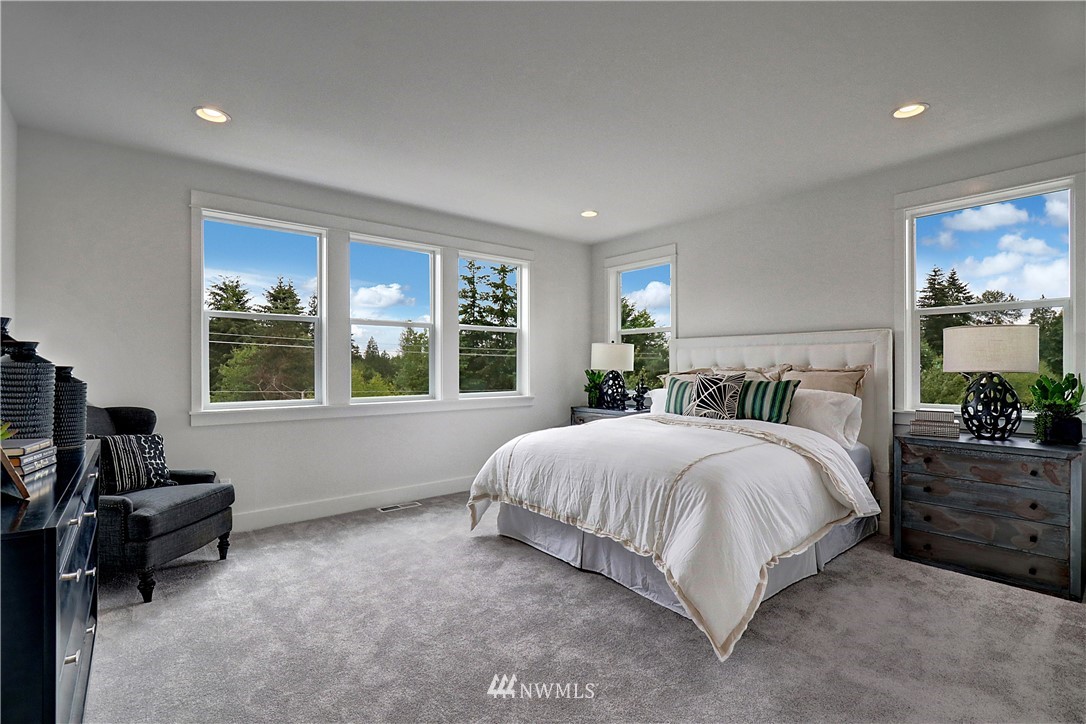 3304 219th Place Southeast, Unit 7 Bothell, WA 98021 - Photo 13 of 25 a bedroom with a bed and a window