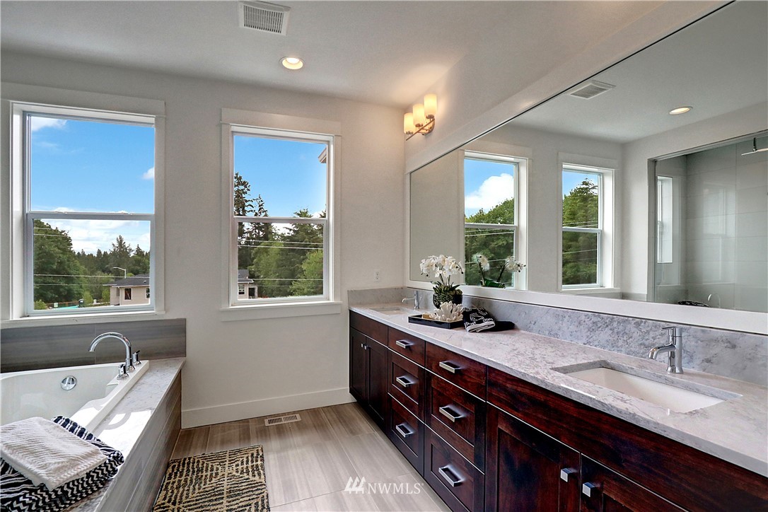 3304 219th Place Southeast, Unit 7 Bothell, WA 98021 - Photo 14 of 25 a bathroom with a sink double vanity and a bathtub