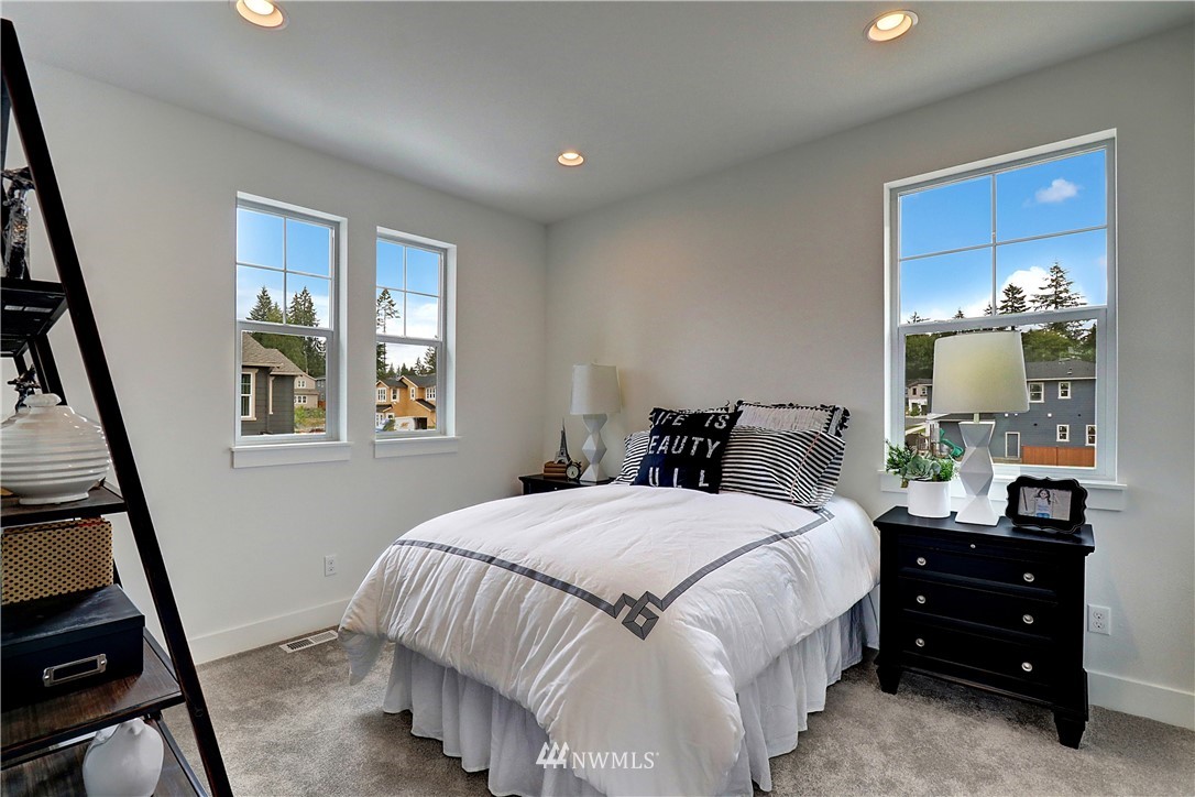3304 219th Place Southeast, Unit 7 Bothell, WA 98021 - Photo 15 of 25 a bedroom with a bed and a window