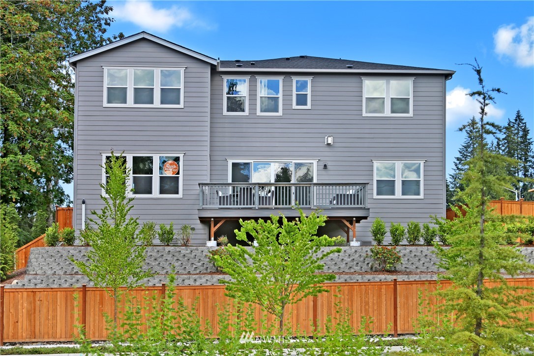 3304 219th Place Southeast, Unit 7 Bothell, WA 98021 - Photo 17 of 25 a front view of a house with a yard