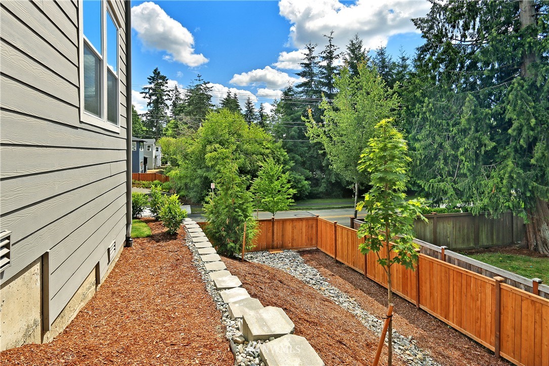 3304 219th Place Southeast, Unit 7 Bothell, WA 98021 - Photo 18 of 25 a view of a pathway with a bench