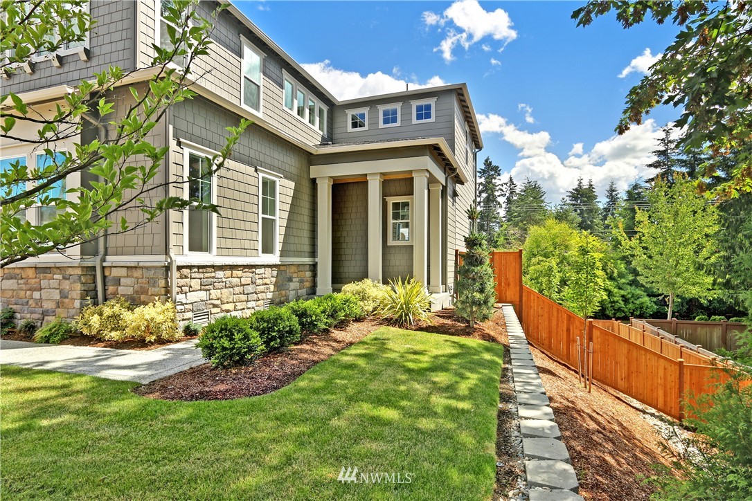 3304 219th Place Southeast, Unit 7 Bothell, WA 98021 - Photo 20 of 25 a front view of a house with garden