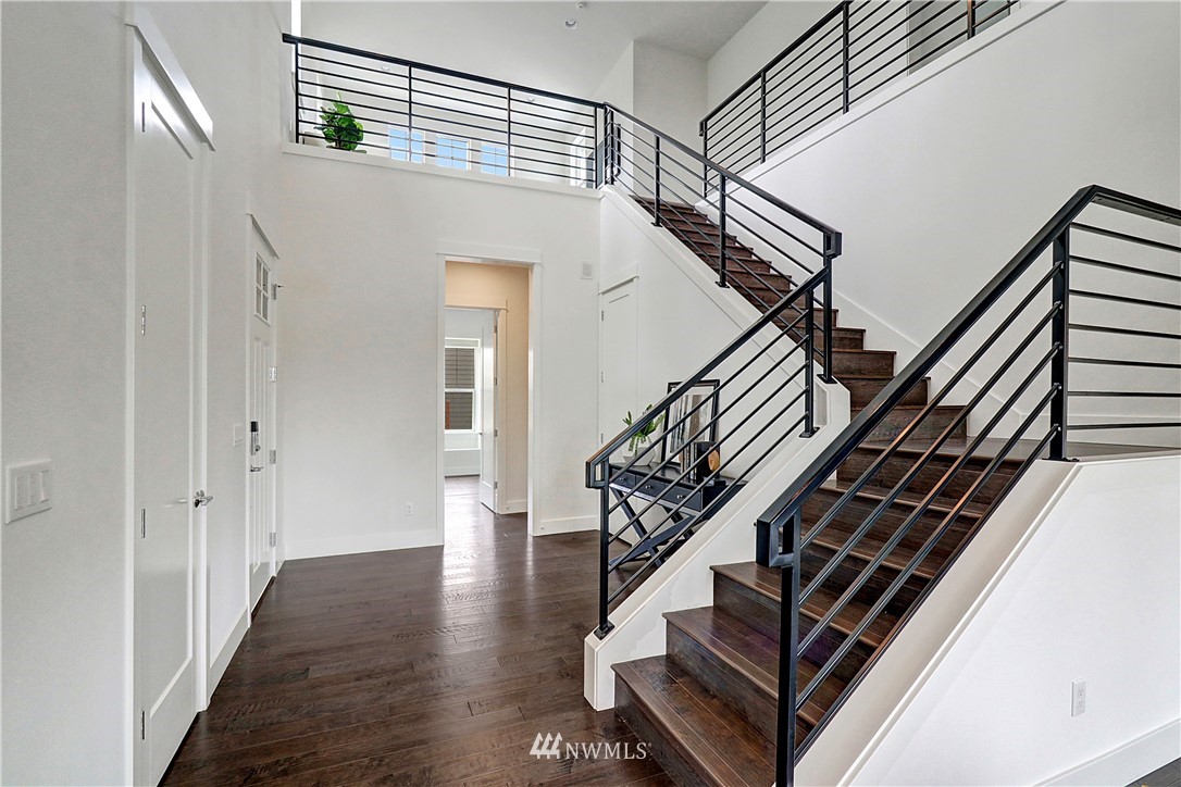 3304 219th Place Southeast, Unit 7 Bothell, WA 98021 - Photo 3 of 25 a view of entryway and hall with wooden floor