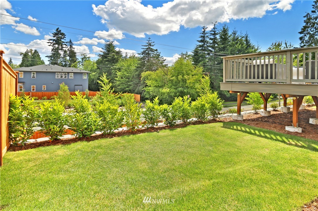 3304 219th Place Southeast, Unit 7 Bothell, WA 98021 - Photo 21 of 25 a view of a house with a backyard and sitting area