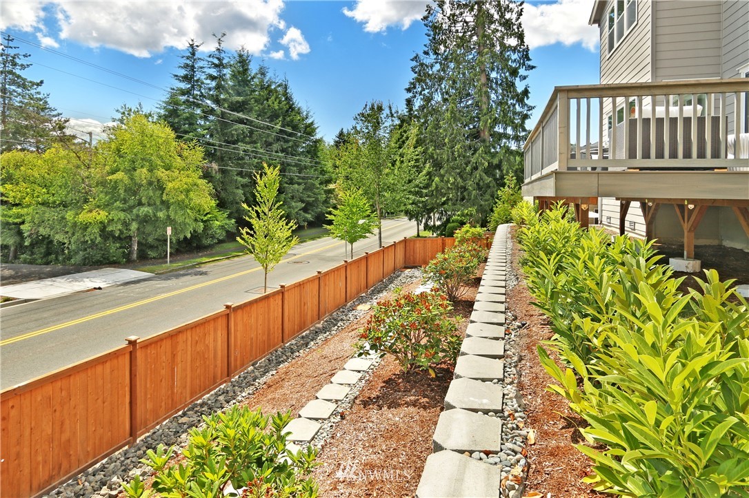 3304 219th Place Southeast, Unit 7 Bothell, WA 98021 - Photo 22 of 25 a view of a pathway with a yard