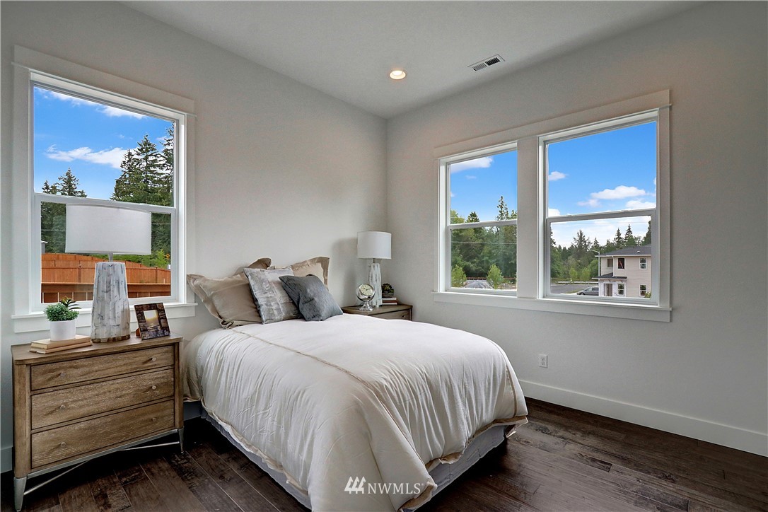 3304 219th Place Southeast, Unit 7 Bothell, WA 98021 - Photo 10 of 25 a bedroom with a bed and a window
