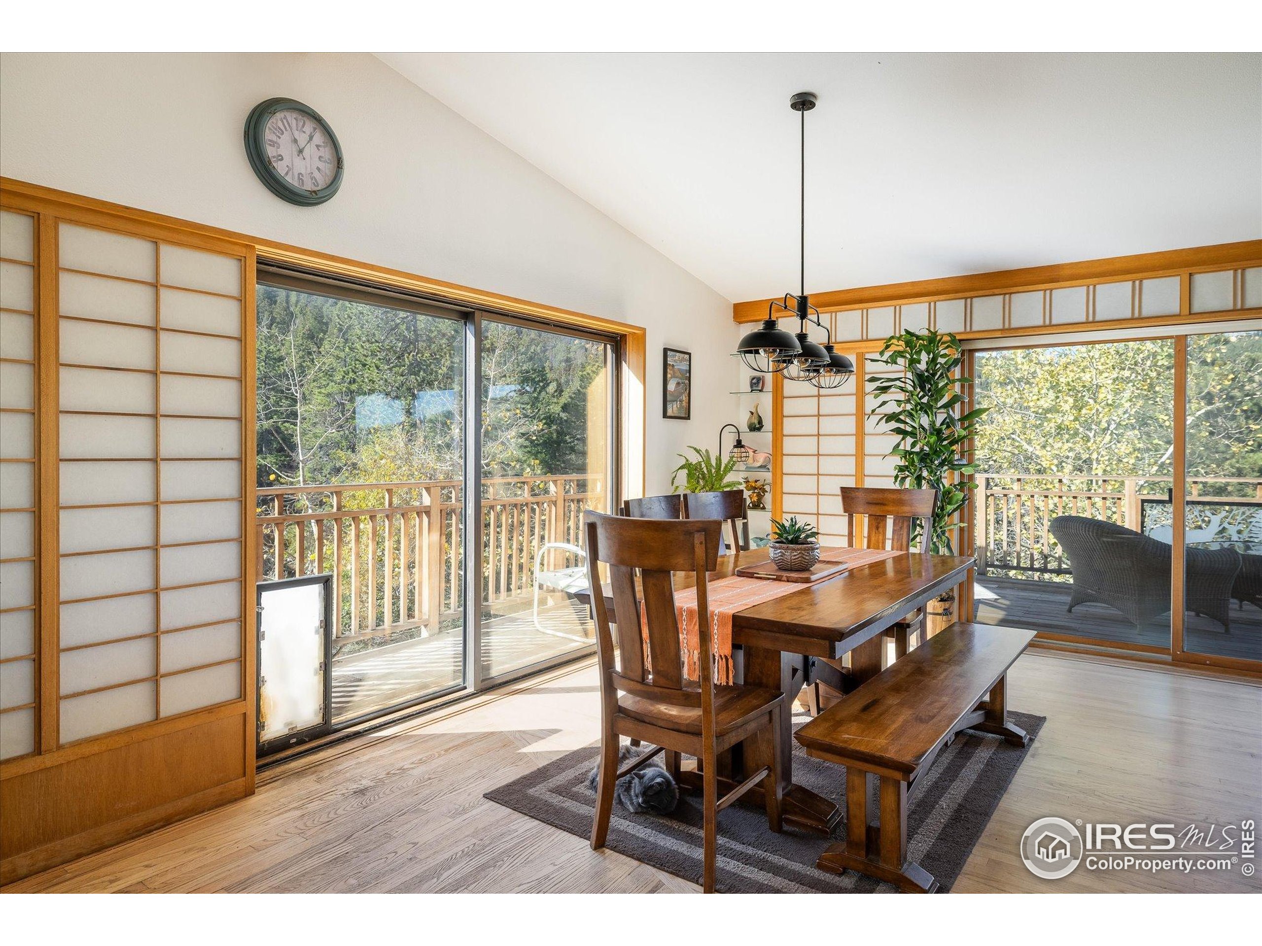 11935 Vonnie Claire Road Golden, CO 80403 - Photo 17 of 42 a view of a dining room with furniture wooden floor and a chandelier