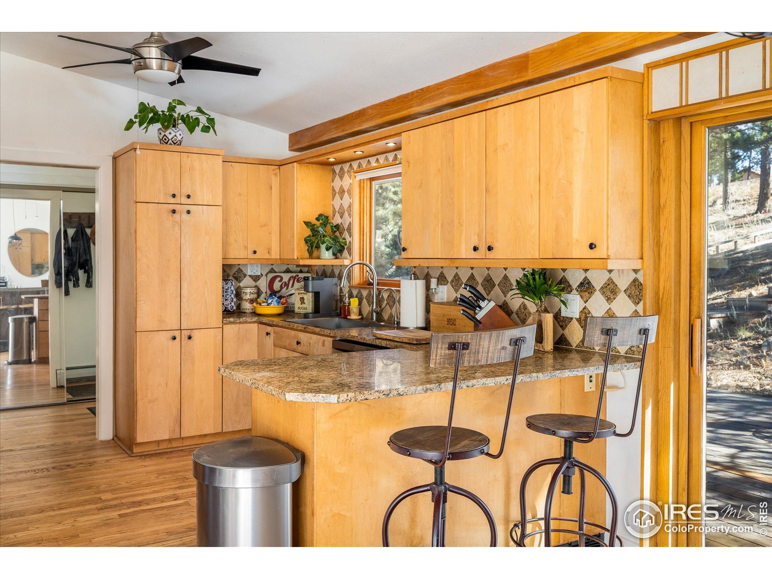 11935 Vonnie Claire Road Golden, CO 80403 - Photo 20 of 42 a view of a kitchen with furniture and a window