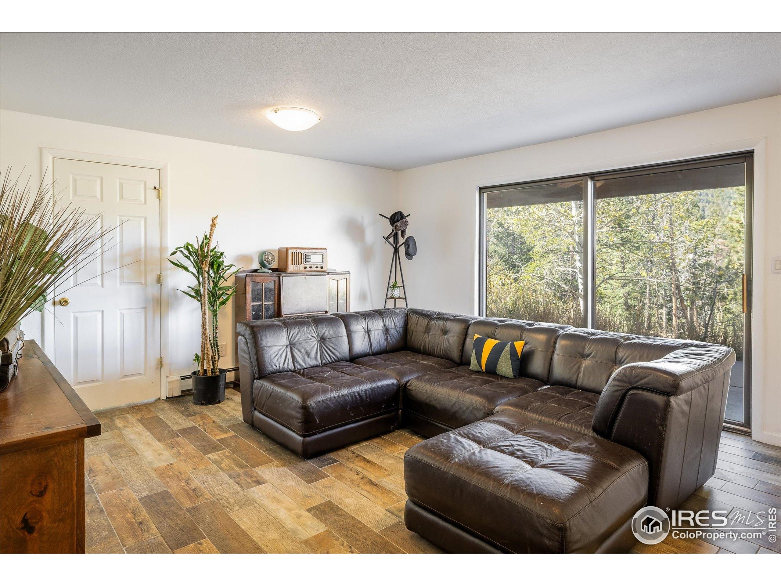 11935 Vonnie Claire Road Golden, CO 80403 - Photo 28 of 42 a living room with furniture and a large window