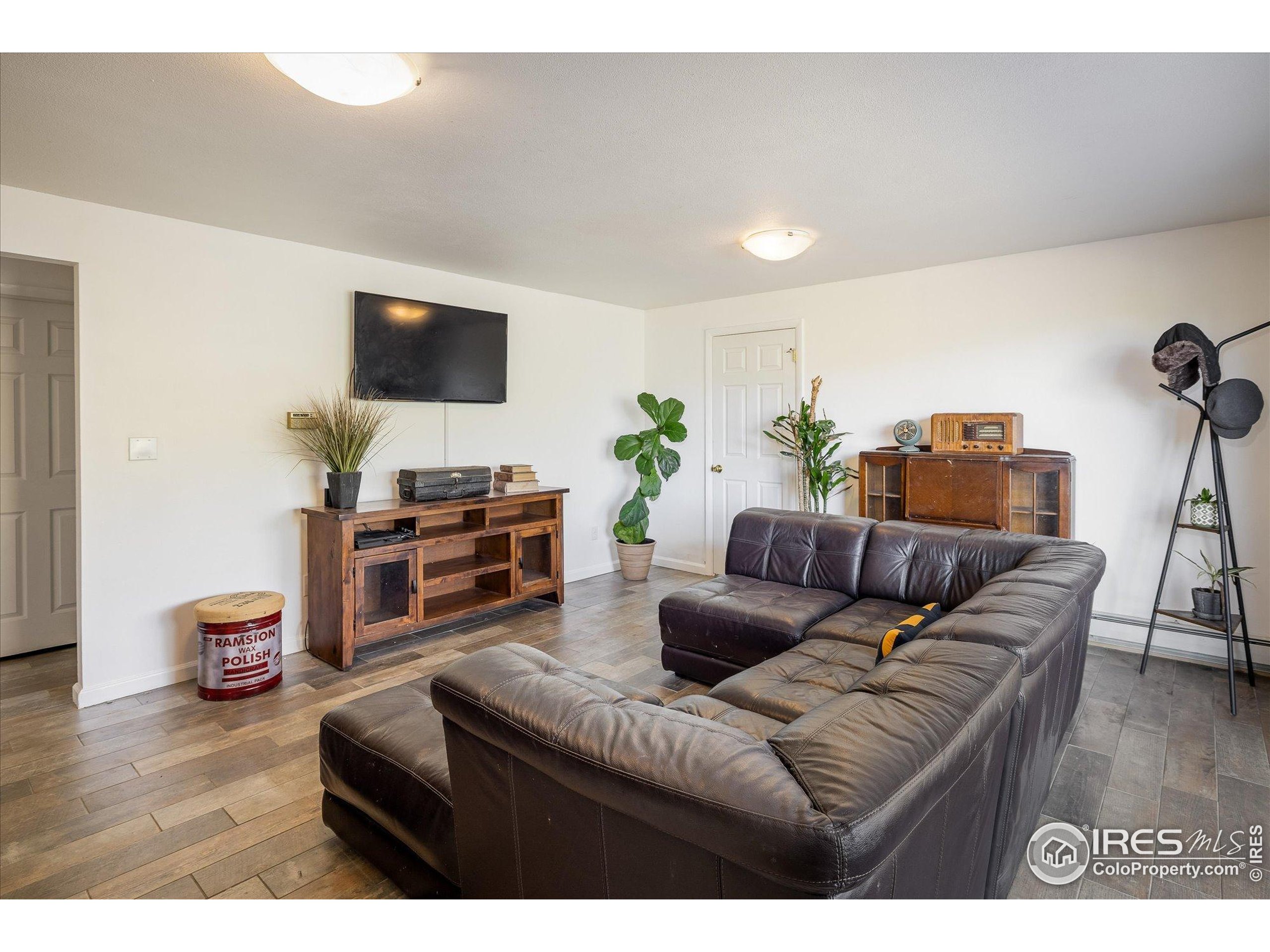 11935 Vonnie Claire Road Golden, CO 80403 - Photo 29 of 42 a living room with furniture and a flat screen tv