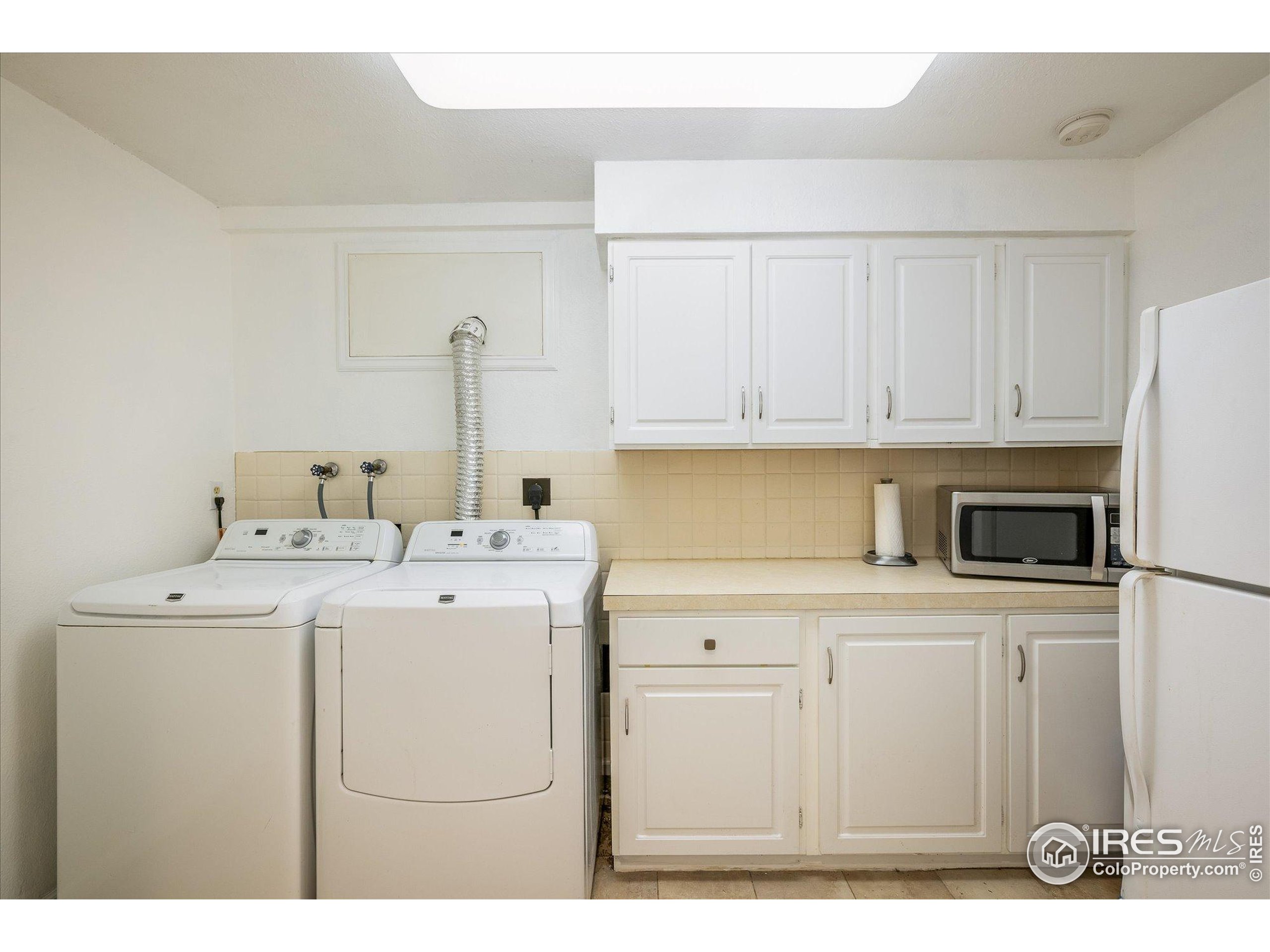 11935 Vonnie Claire Road Golden, CO 80403 - Photo 36 of 42 a utility room with dryer and washer