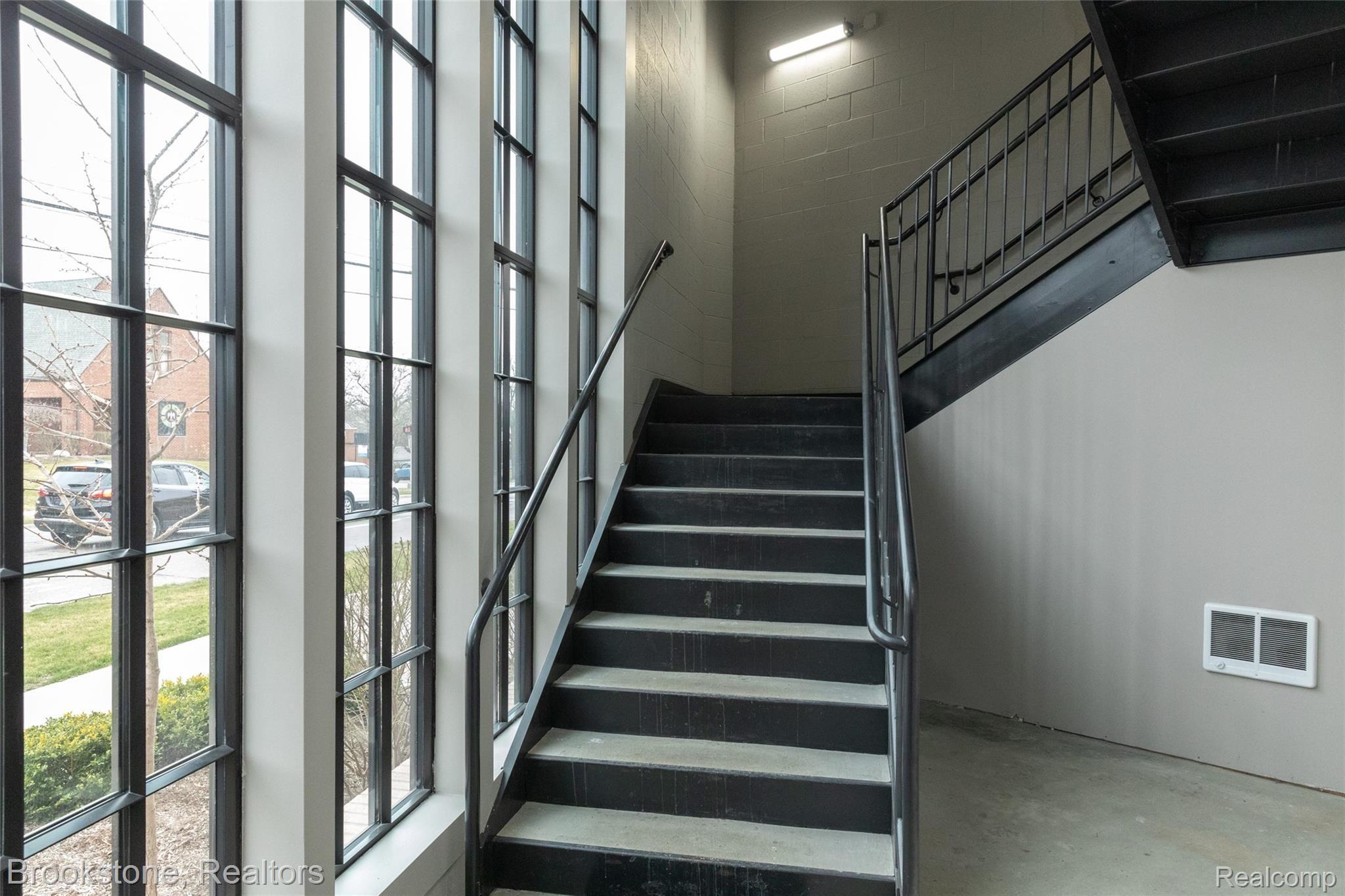 804 North Main Street, Unit 2E(#7) Rochester, MI 48307 - Photo 21 of 24 Stairway access also available adjacent to your 2 parking spacees