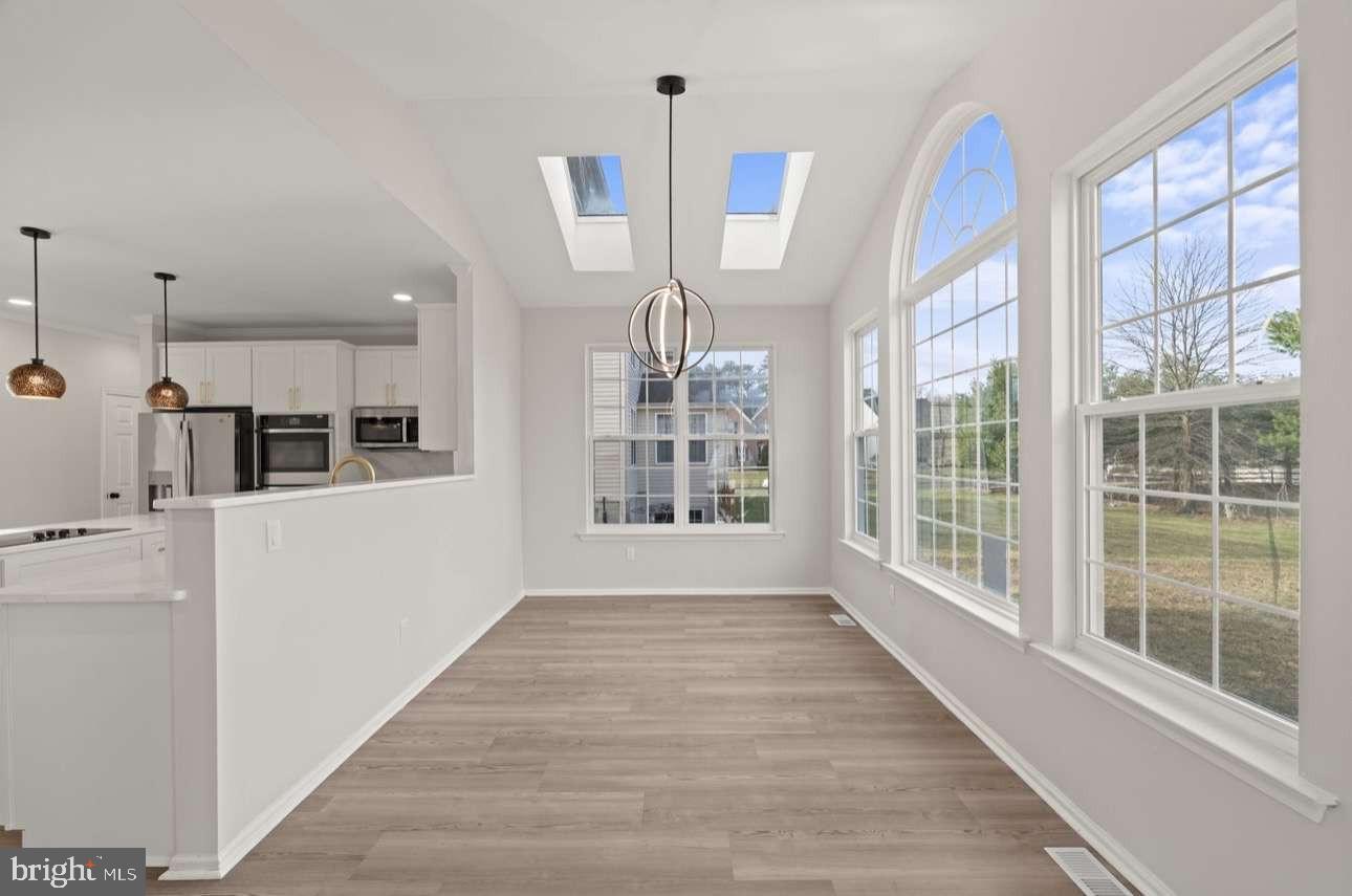 4 Box Turtle Lane Sicklerville, NJ 08081 - Photo 14 of 37 a view of an empty room with wooden floor and a window