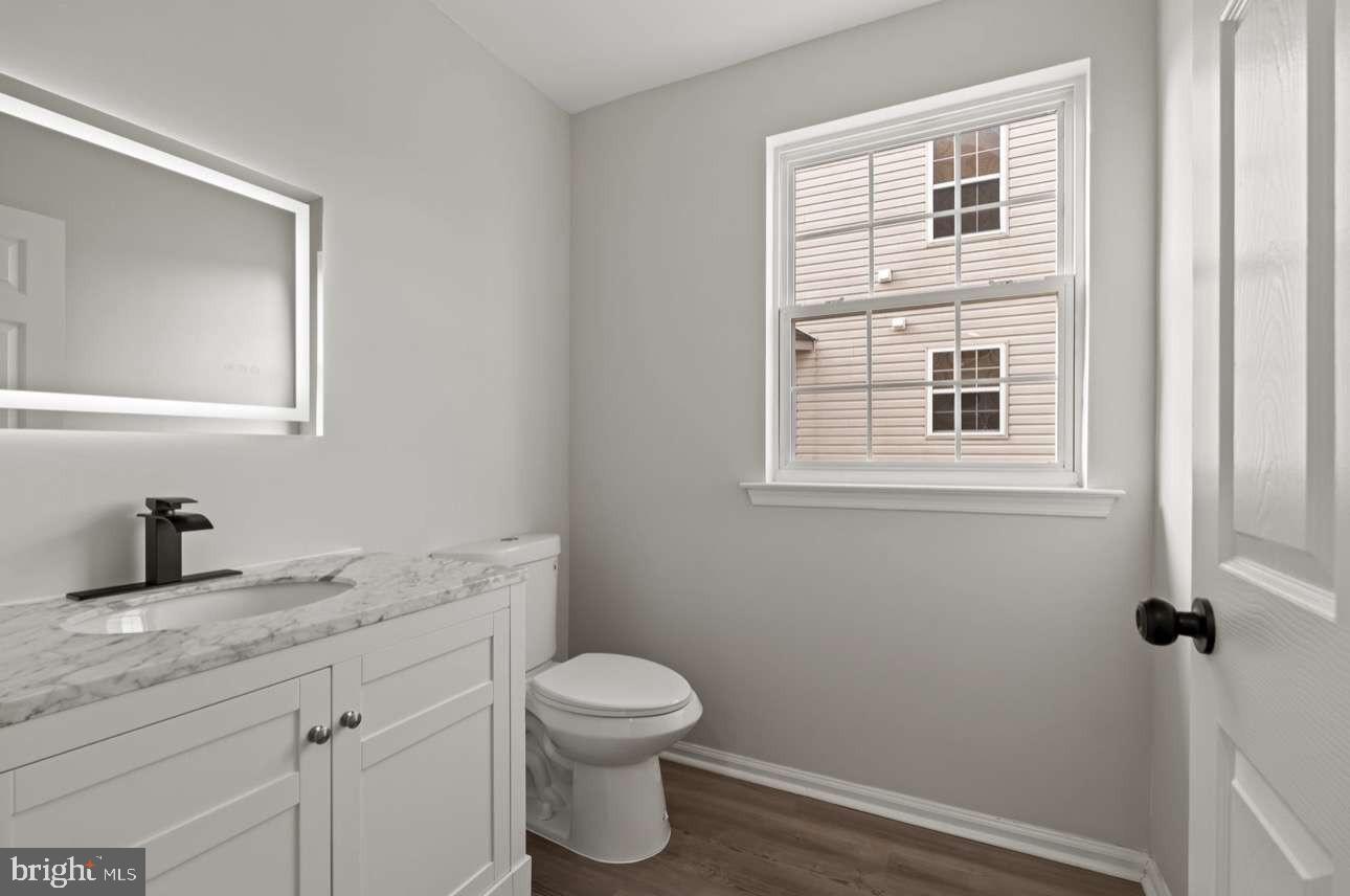 4 Box Turtle Lane Sicklerville, NJ 08081 - Photo 17 of 37 a bathroom with a granite countertop toilet sink and mirror