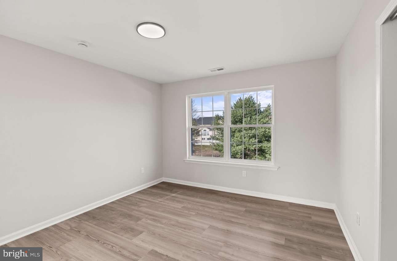 4 Box Turtle Lane Sicklerville, NJ 08081 - Photo 21 of 37 an empty room with wooden floor and windows