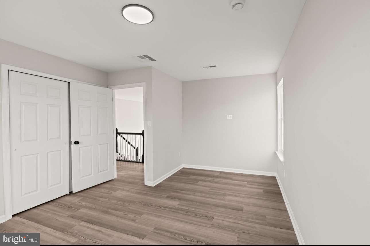 4 Box Turtle Lane Sicklerville, NJ 08081 - Photo 22 of 37 a view of an empty room with wooden floor