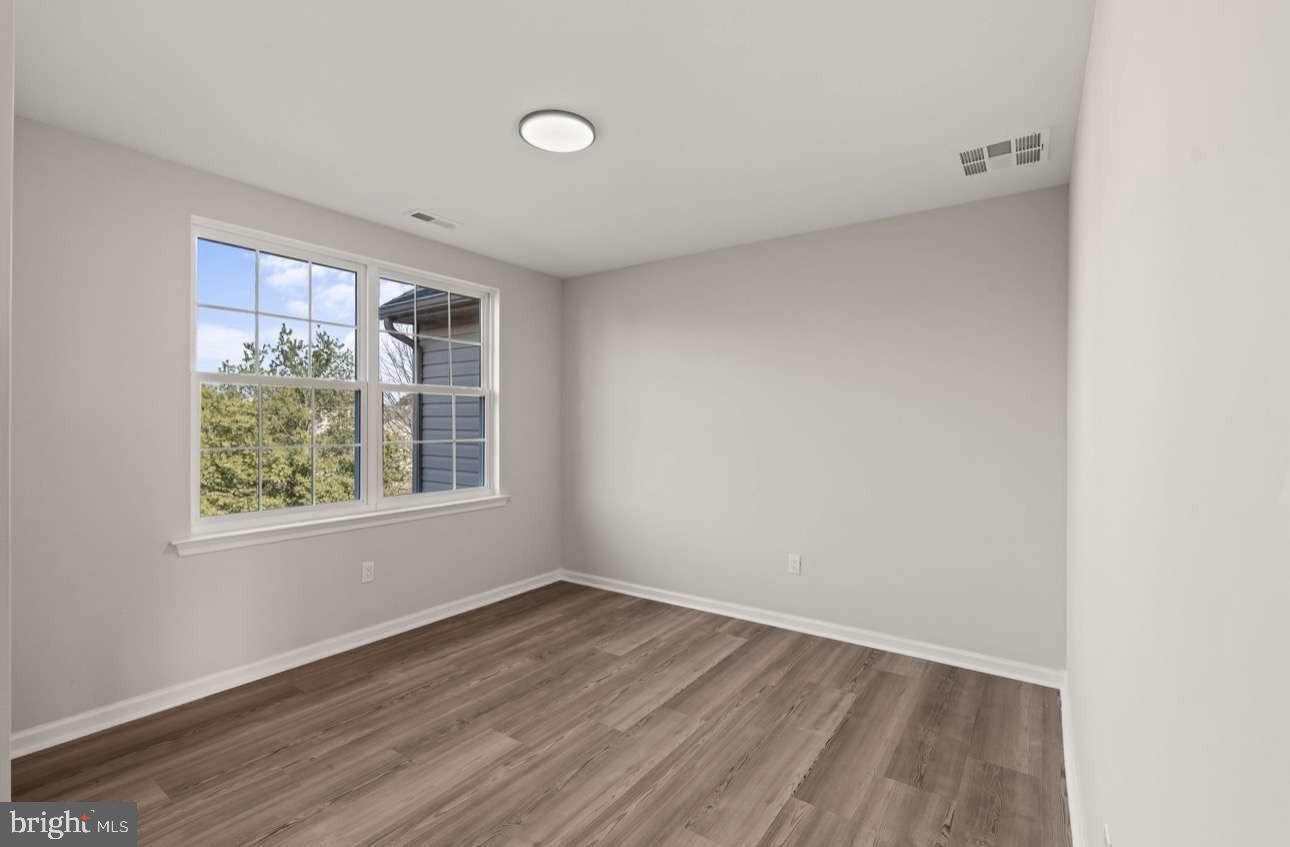 4 Box Turtle Lane Sicklerville, NJ 08081 - Photo 26 of 37 an empty room with wooden floor and windows