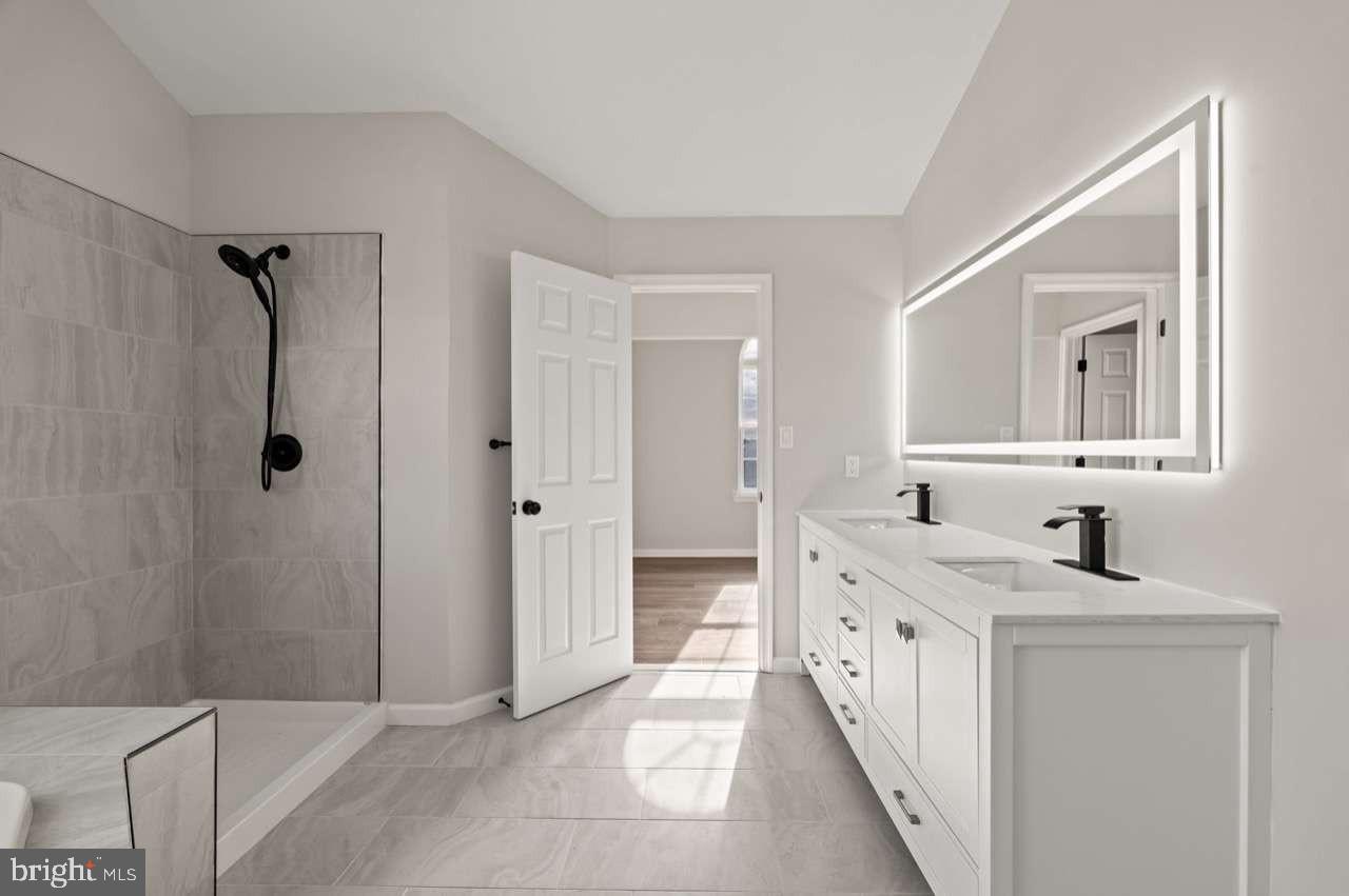 4 Box Turtle Lane Sicklerville, NJ 08081 - Photo 32 of 37 a bathroom with a double vanity sink mirror and shower