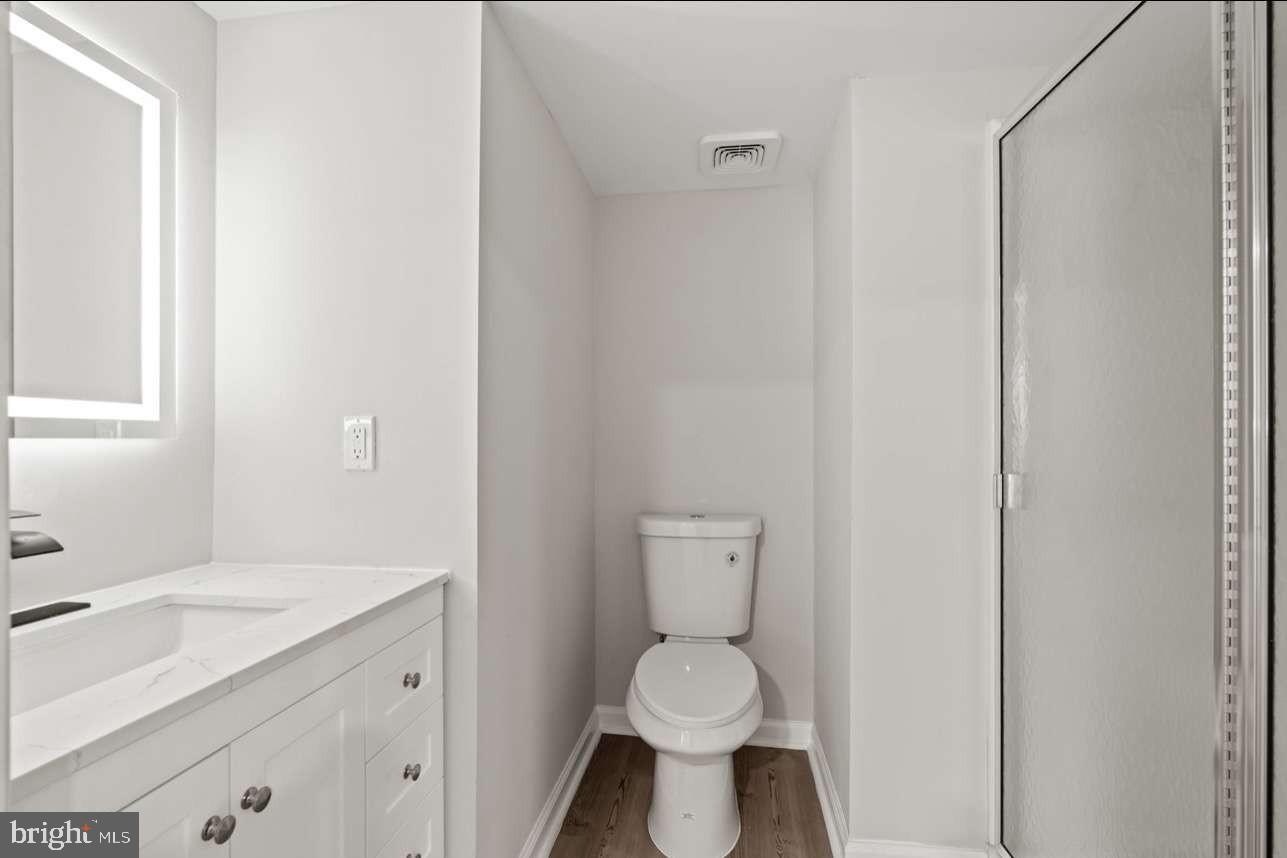 4 Box Turtle Lane Sicklerville, NJ 08081 - Photo 36 of 37 a bathroom with a toilet a sink and mirror