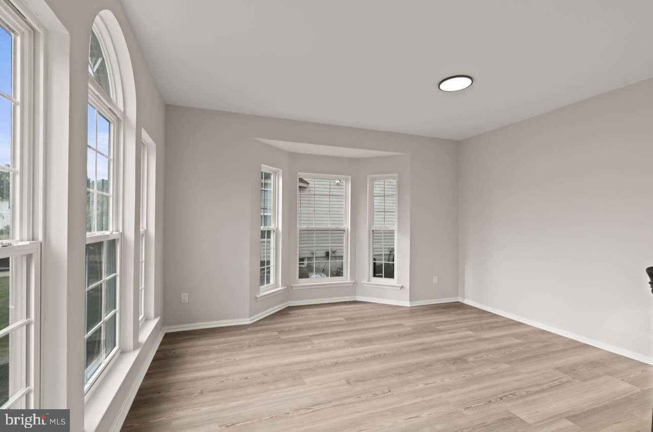 4 Box Turtle Lane Sicklerville, NJ 08081 - Photo 6 of 37 a view of a livingroom with wooden floor and a window
