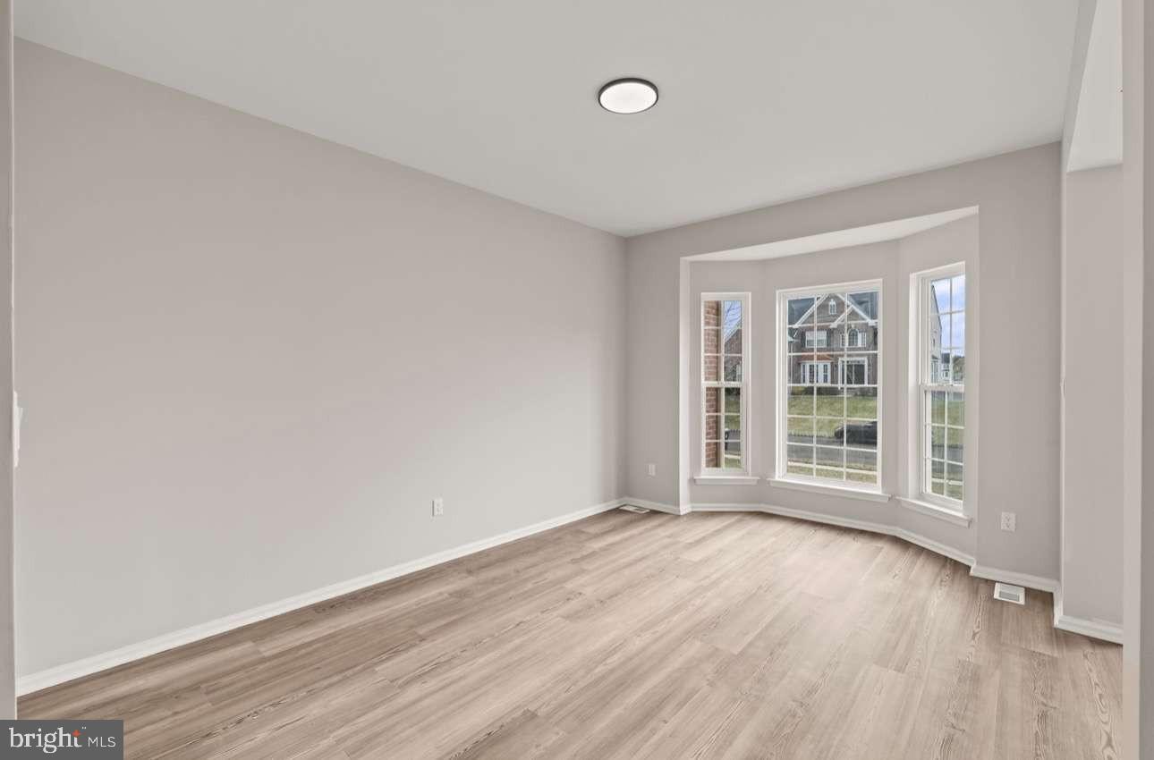 4 Box Turtle Lane Sicklerville, NJ 08081 - Photo 8 of 37 an empty room with wooden floor and windows
