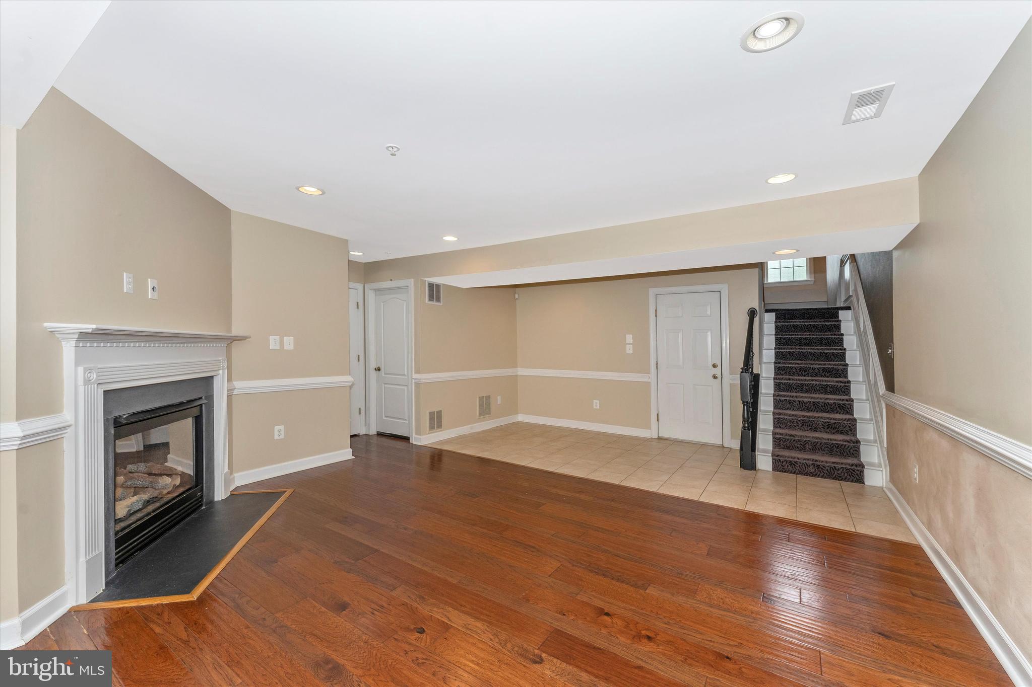 2305 Abby Road Edgewater, MD 21037 - Photo 16 of 36 Lower level rec room with gas file place