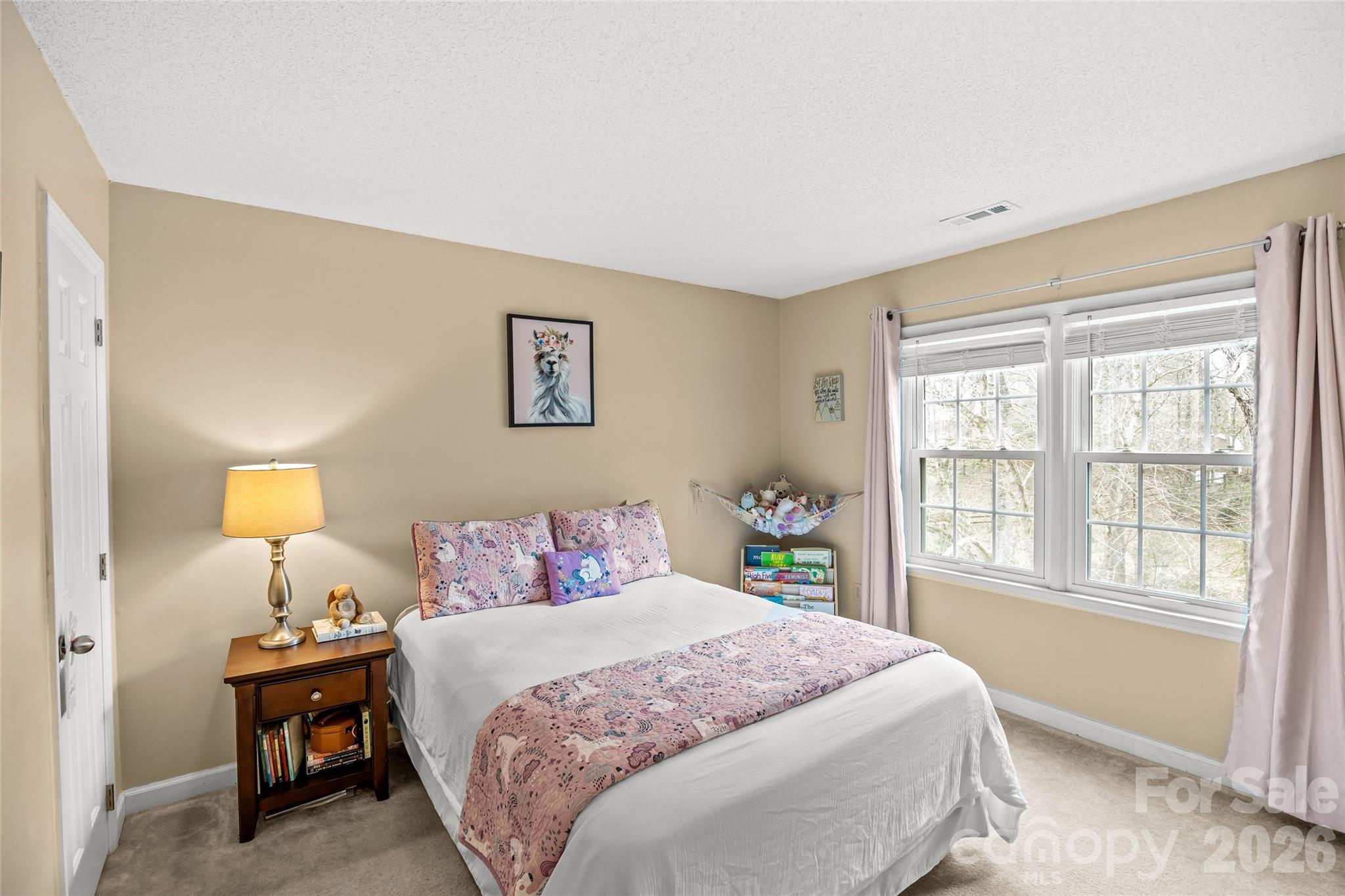9619 Radner Lane Charlotte, NC 28277 - Photo 27 of 44 a bedroom with a bed and a window