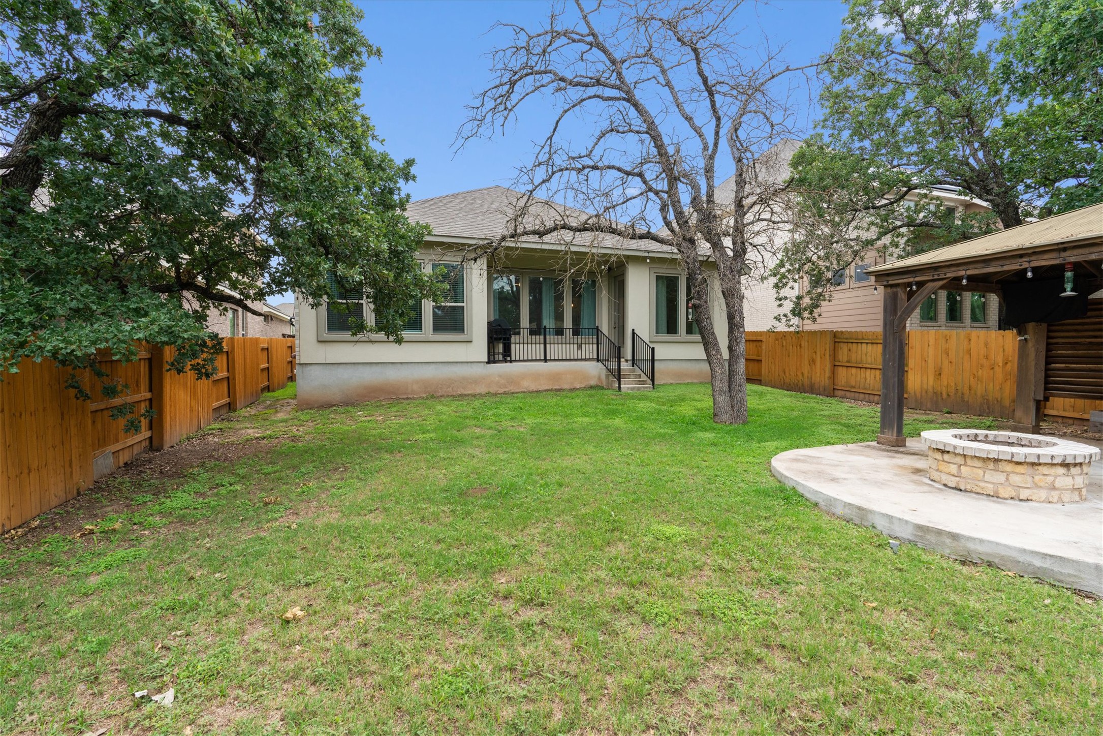941 Del Raphael Drive Leander, TX 78641 - Photo 22 of 31 The patio looks straight out into the trees, making it a peaceful spot for your morning routine