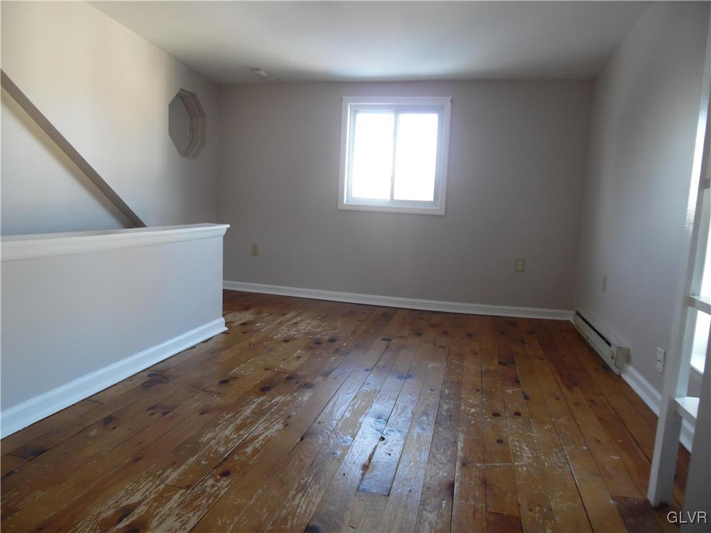 223 East Raspberry Street Bethlehem, PA 18018 - Photo 20 of 20 an empty room with wooden floor and windows