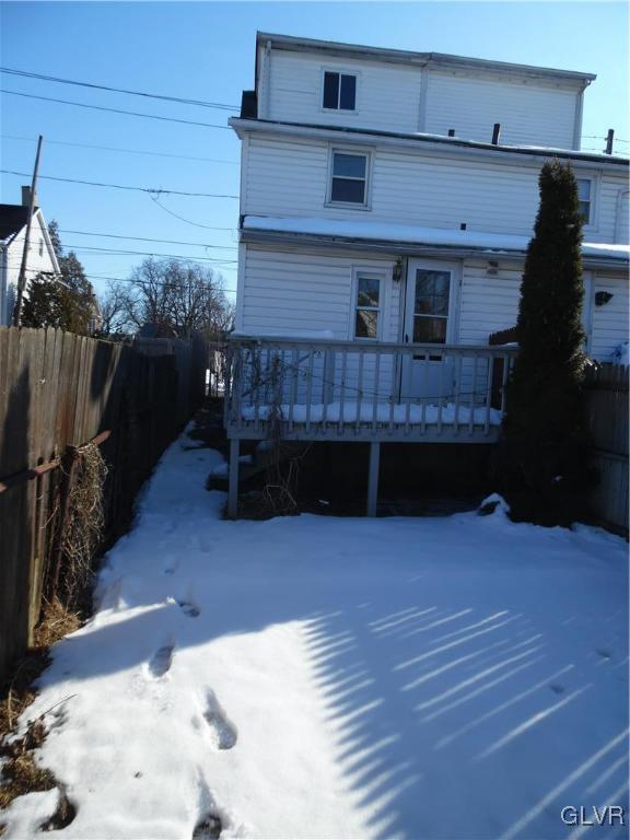 223 East Raspberry Street Bethlehem, PA 18018 - Photo 3 of 20 a view of backyard with a large tree and wooden fence