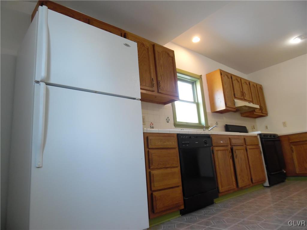 223 East Raspberry Street Bethlehem, PA 18018 - Photo 6 of 20 a kitchen with stainless steel appliances granite countertop a refrigerator and a sink