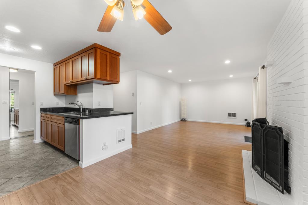 99 East Middlefield Road, Unit 41 Mountain View, CA 94043 - Photo 7 of 37 a kitchen with stainless steel appliances granite countertop a stove a sink and a refrigerator