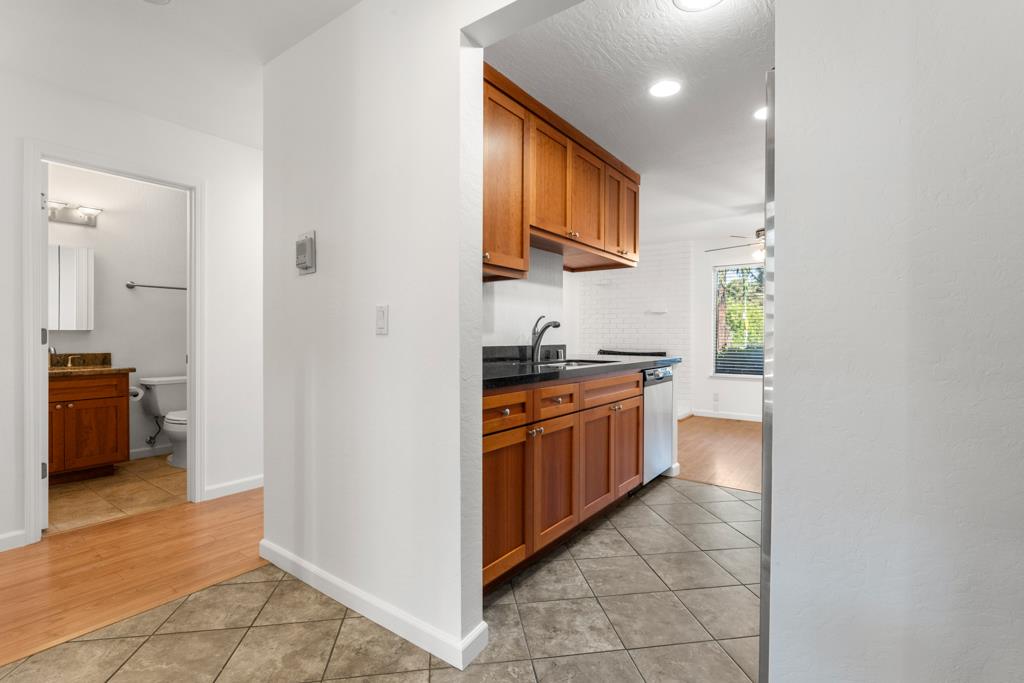 99 East Middlefield Road, Unit 41 Mountain View, CA 94043 - Photo 9 of 37 a large kitchen with stainless steel appliances granite countertop a refrigerator and a sink
