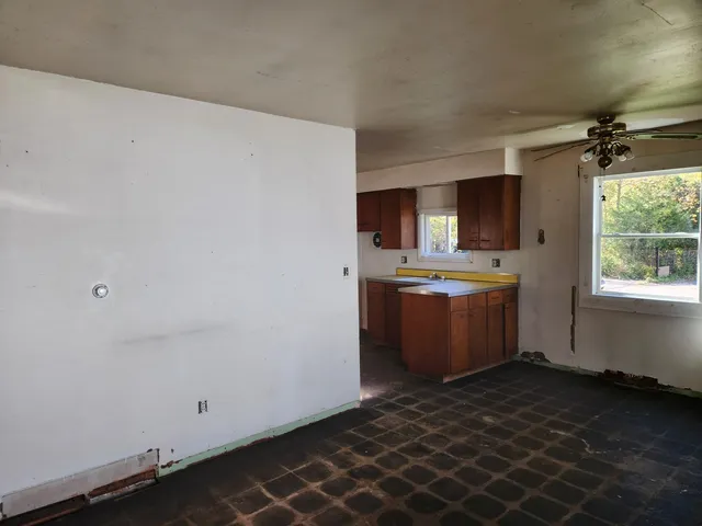a room with a sink and cabinets