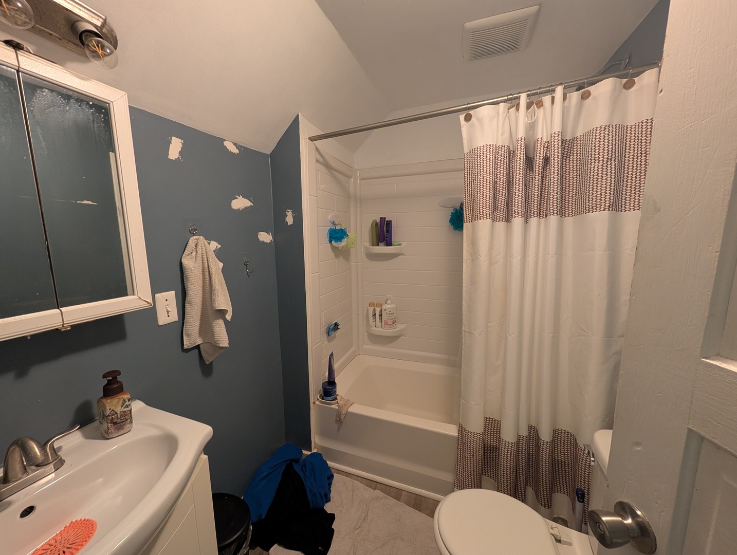 1118 15th Street Moline, IL 61265 - Photo 9 of 11 a bathroom with a sink toilet and shower