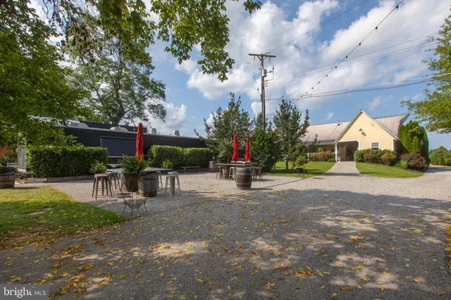 a view of yard with table and chairs