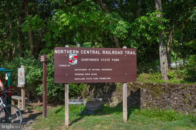 a sign on the side of the tree