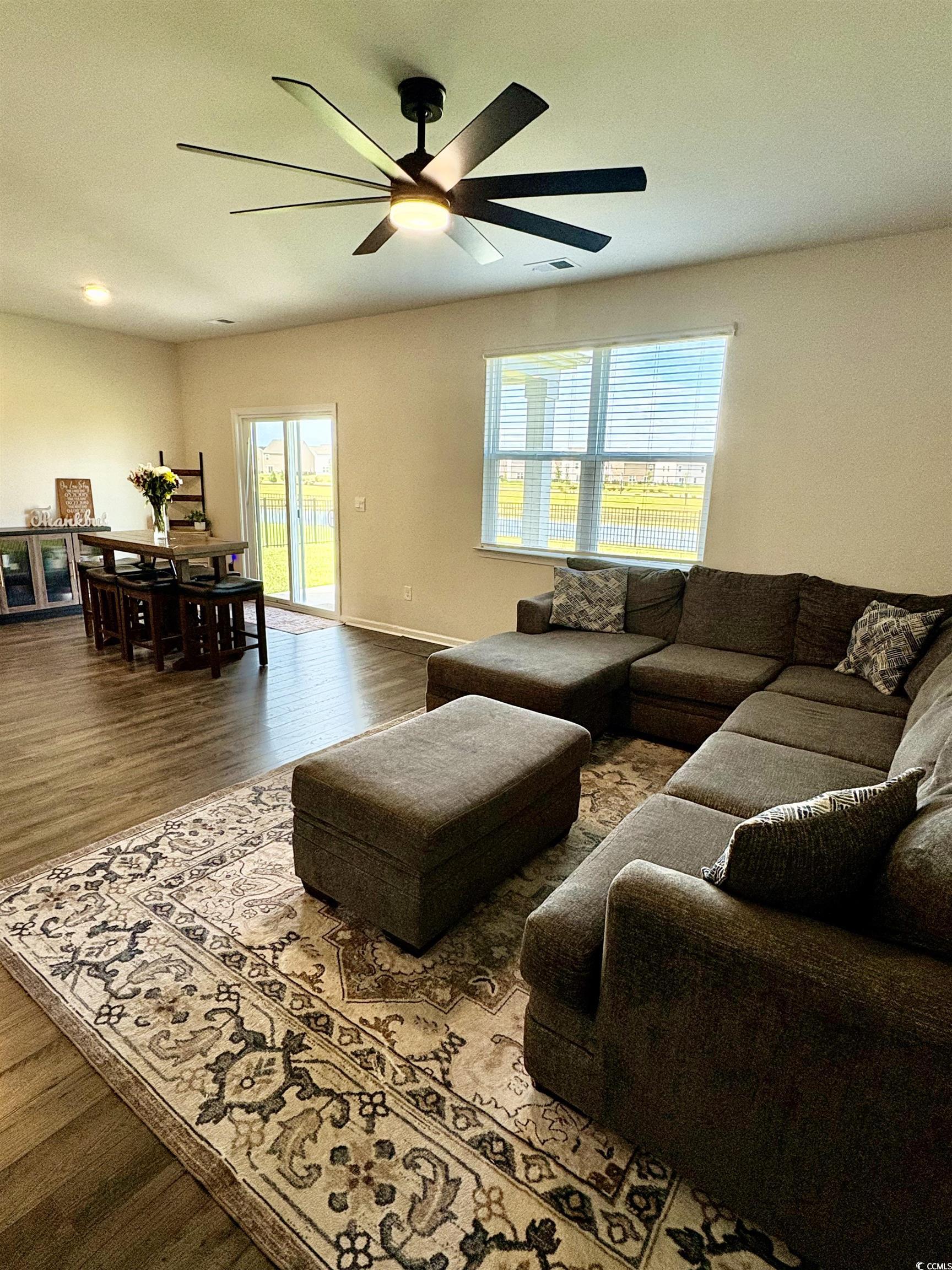 1715 Perthshire Loop Myrtle Beach, SC 29579 - Photo 18 of 39 Living area with ceiling fan and wood finished floors