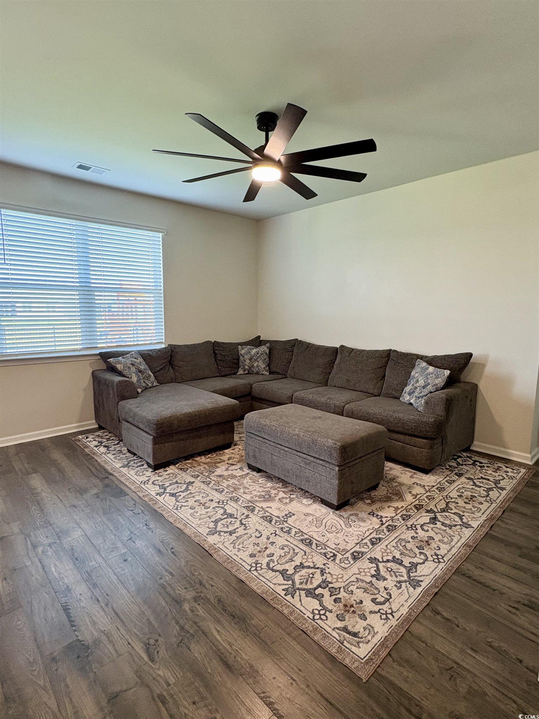 1715 Perthshire Loop Myrtle Beach, SC 29579 - Photo 19 of 39 Living room featuring ceiling fan and dark wood-style flooring