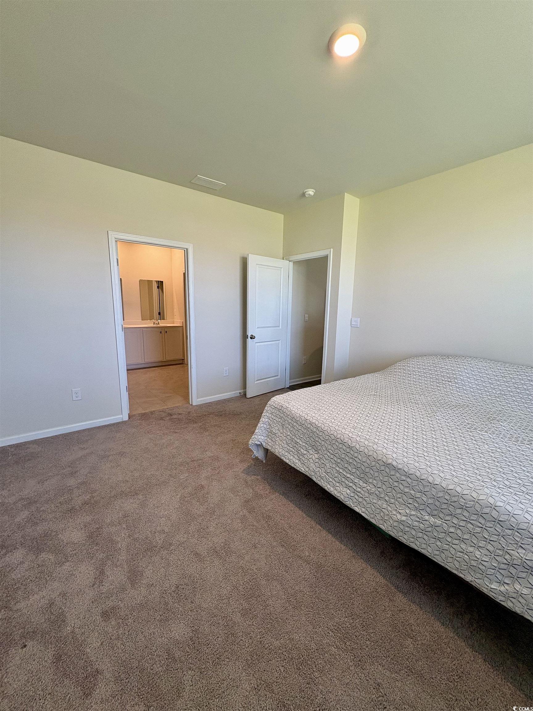 1715 Perthshire Loop Myrtle Beach, SC 29579 - Photo 21 of 39 Bedroom with carpet flooring and baseboards