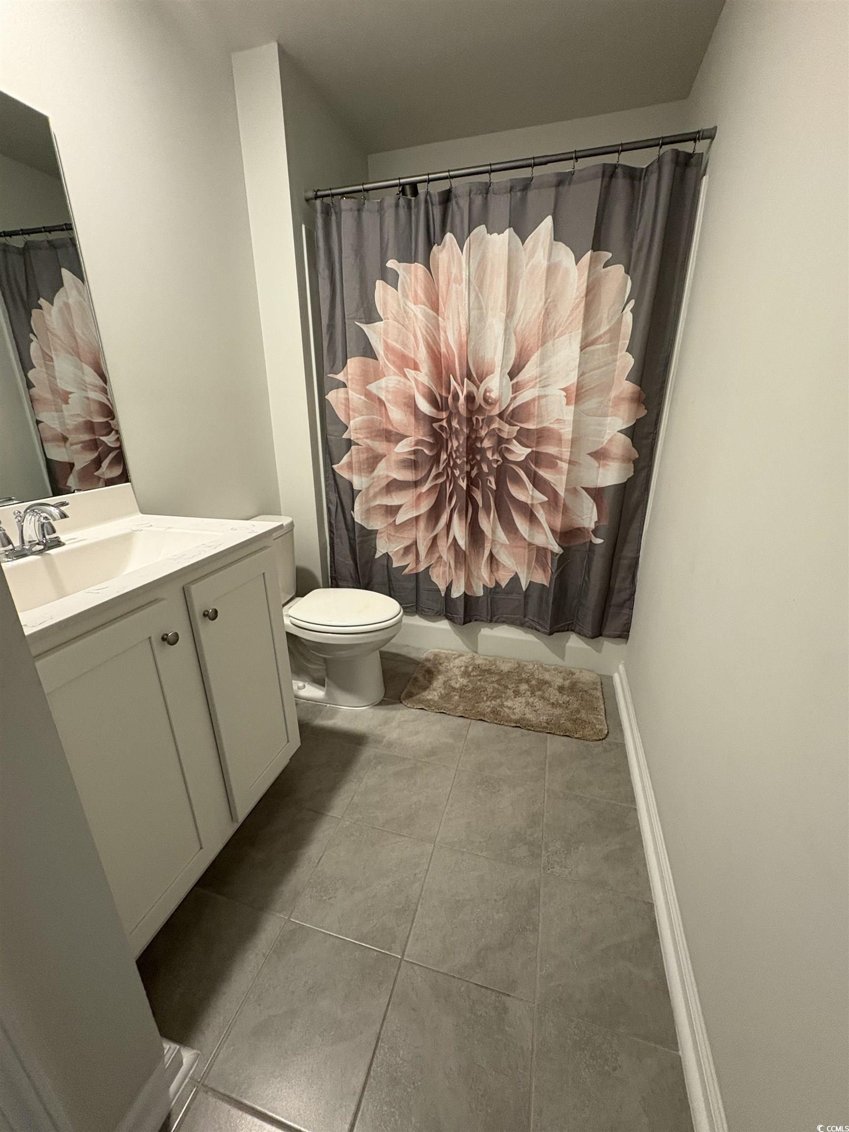 1715 Perthshire Loop Myrtle Beach, SC 29579 - Photo 30 of 39 Bathroom with vanity, tile patterned flooring, and a shower with shower curtain
