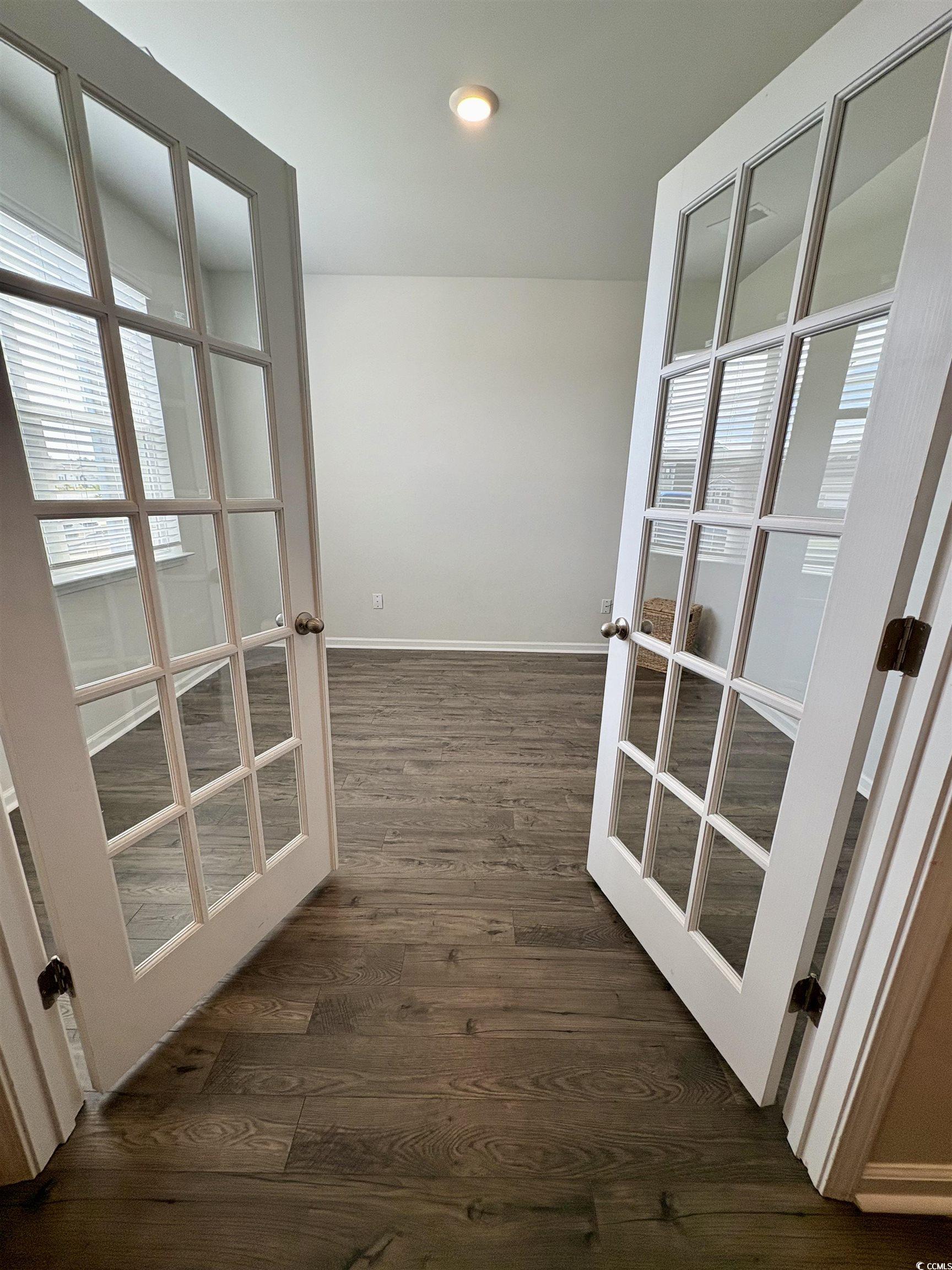 1715 Perthshire Loop Myrtle Beach, SC 29579 - Photo 8 of 39 Corridor featuring dark wood-type flooring, plenty of natural light, and french doors