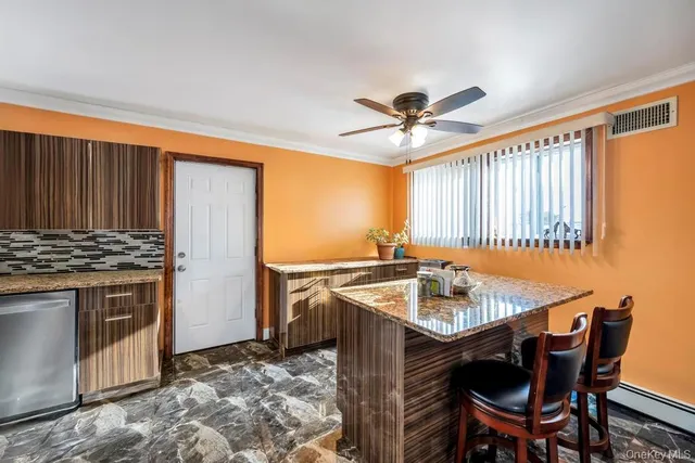 a kitchen with a stove a sink and a refrigerator
