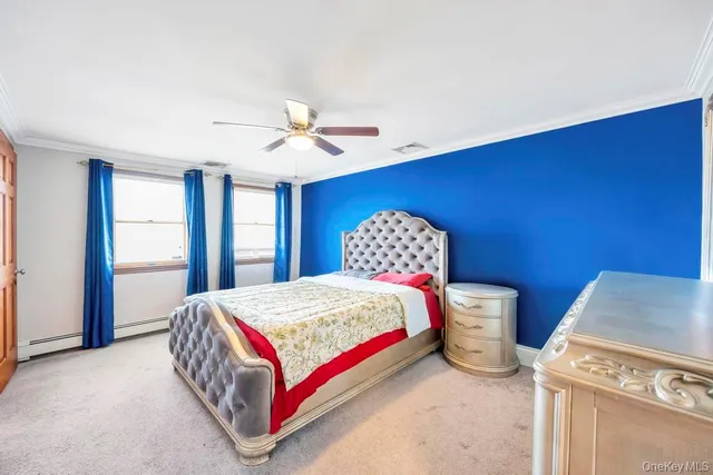 a bedroom with a bed a table and chair