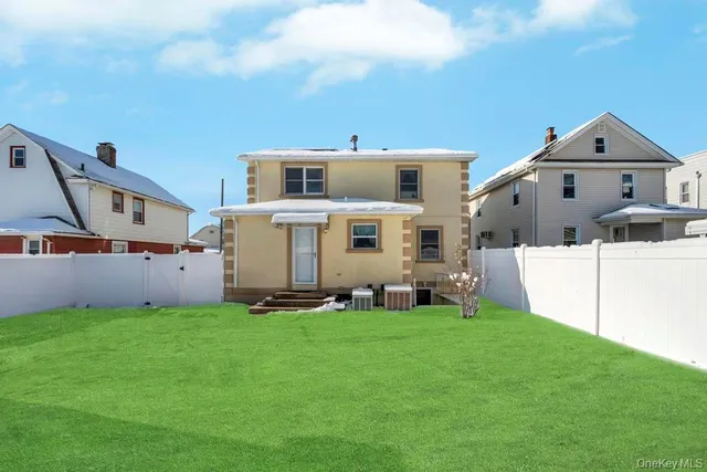 a view of a house with a yard and porch