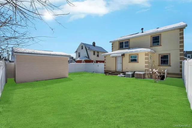 a view of a backyard with plants