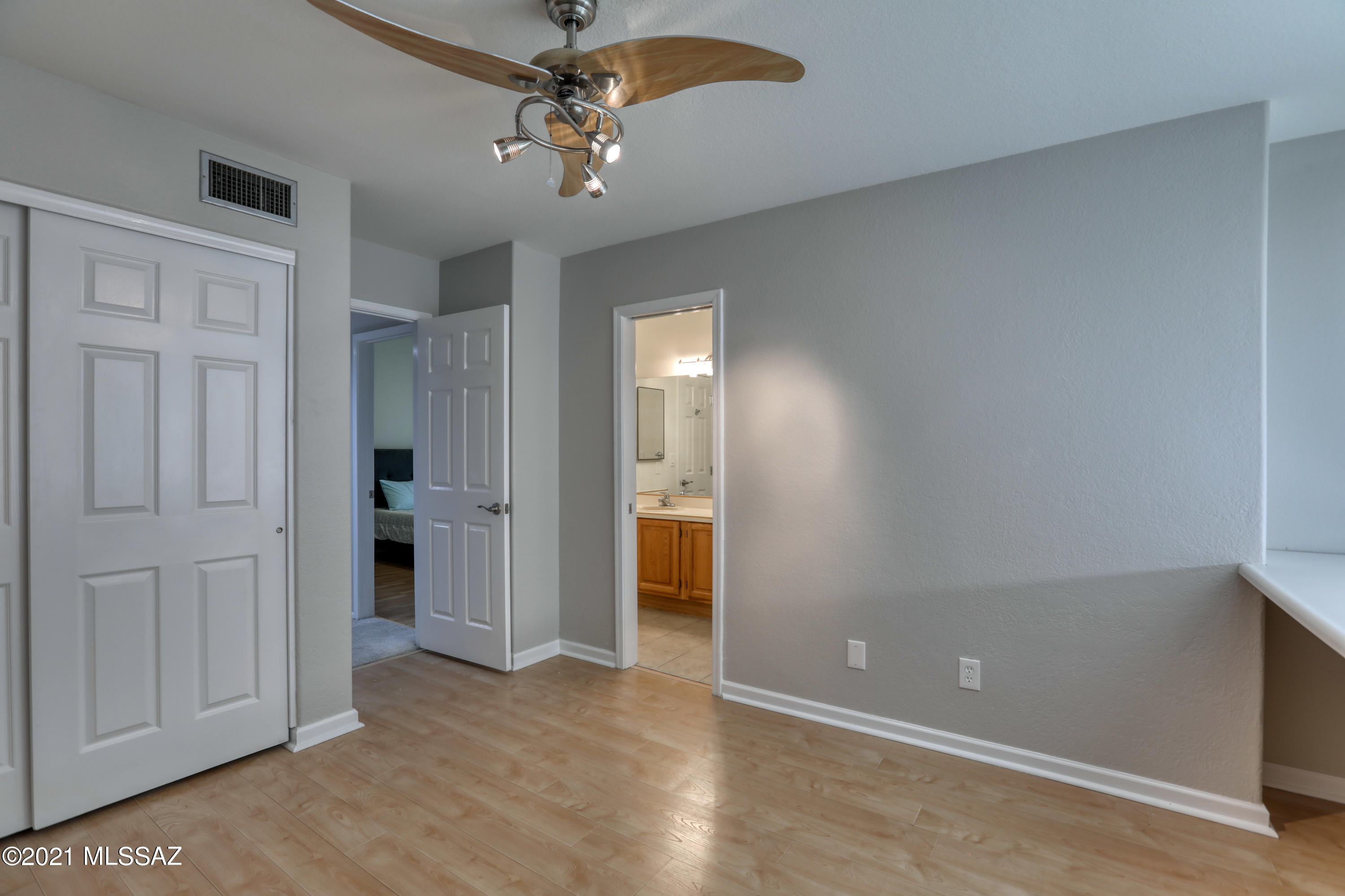 12560 North Wayfarer Way Oro Valley, AZ 85755 - Photo 37 of 43 wooden floor in an empty room with a window